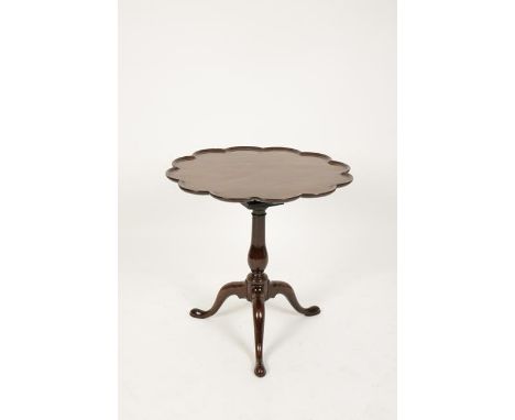 A GEORGE III MAHOGANY TRIPOD TABLE with a dished lobed top on a revolving bird cage and baluster turned column with three dow