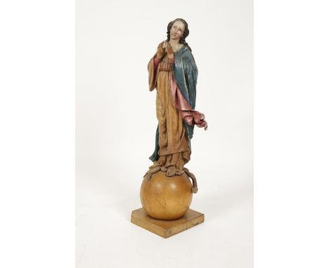 A POLYCHROME PAINTED CARVED FIGURE OF THE BLESSED VIRGIN MARY standing on a sphere with hands together, wearing a painted clo