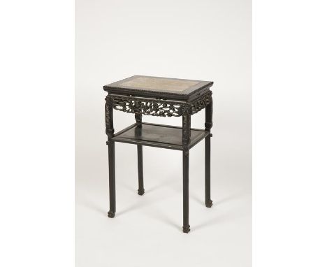 A CHINESE HARDWOOD MARBLE-TOP TABLE of rectangular form with a carved frieze and lower shelf, late Qing-Republic, 31" high x 