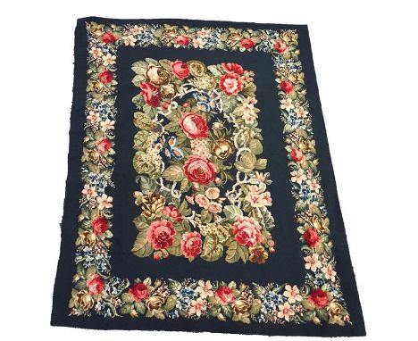 A TAPESTRY WALL HANGING, the dark blue ground worked in the 18th century style with polychrome flowers and leafage, 67" x 54"