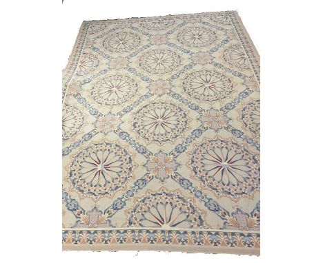 AN 18TH CENTURY STYLE WALL HANGING/CARPET, the cream ground worked with ivory and pastel shaded floral roundels, within an ac