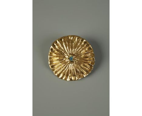 A LUCIE RIE GILT CERAMIC BROOCH of stylised seed form, unsigned, 1.75" dia., in original box. Provenance: Given to the vendor