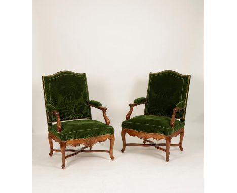 A PAIR OF LOUIS XV UPHOLSTERED ARMCHAIRS with upholstered backs, seats and arms, on scrolling shell-carved frames with short 