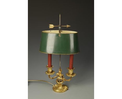 A GILT METAL AND TOLE PEINTE LAMP BOUILLOTTE with rococo style base with twin candle branches, 20" high