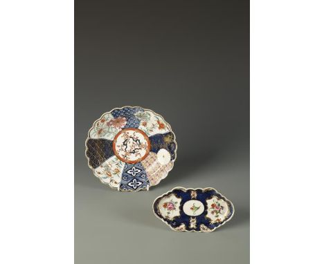 A WORCESTER PLATE decorated in Kakiemon style, Mosaic pattern, blue painted Chinese numeral mark, c. 1768, 7.5" dia., and a W