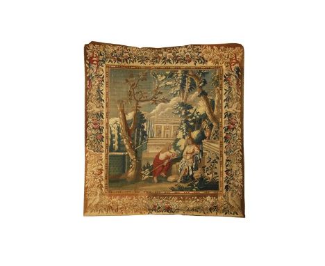 A MORTLAKE MYTHOLOGICAL TAPESTRY worked with a landscape with a temple to the distance surrounded by trees, within a floral a