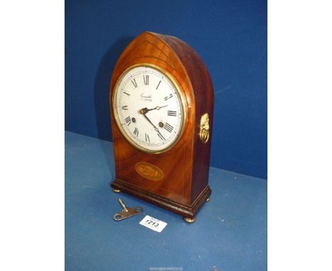 A Comitti of London mantle Clock with two brass lion handles to sides, four brass feet and white face, with key, 10 3/4'' hig