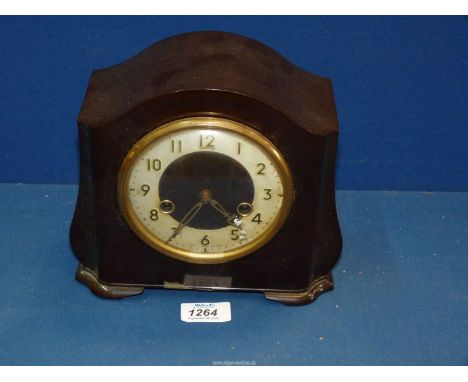 A Smiths Bakelite mantle clock with key, 8 1/2" wide x 7 1/2" tall.