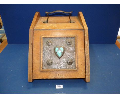 A light oak Coal Scuttle with metal liner and having a square Arts & Crafts beaten copper panel with turquoise polished stone