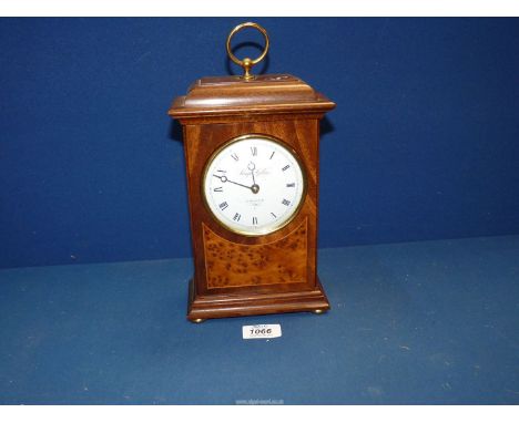 A Knight and Gibbins London, Walnut and Mahogany clockwork mantle clock, white enamel face, Roman numerals, standing on brass