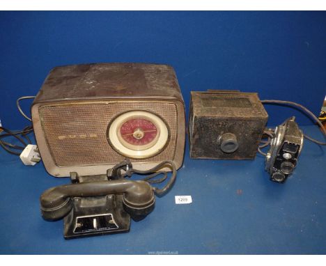 A film projector, a Quartz M film recorder, Reliance telephone and a Bush radio (a/f).