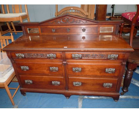 A Walnut/Mahogany Sideboard having an upstand including a pair of bevelled mirror panels, the base with six short drawers, th