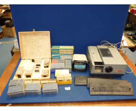 A Gnome Supreme slide projector and a Halina Paramount slide viewer, plus slides.