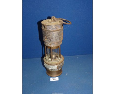 A Hall Woods regulator oil lamp, 11'' high.