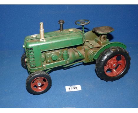 A green metal model tractor by Lesser and Pavey Ltd., 10 1/2" x 6".