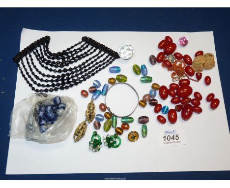 Miscellaneous vintage beads and others, jet dress ornament, Guinness button, etc.