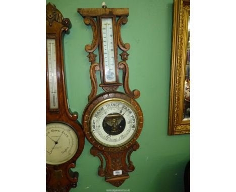 A carved Oak banjo Barometer with mercury thermometer, 33" tall, top missing.