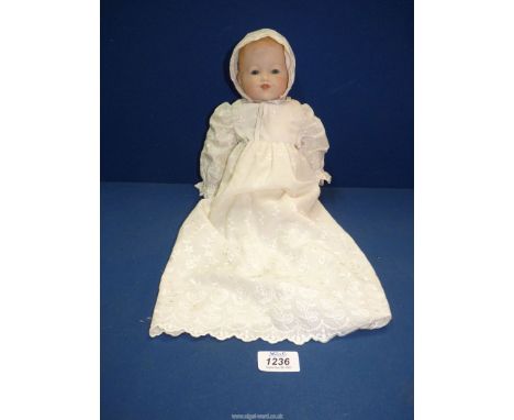A vintage doll with porcelain face, signed on back of the neck A.M. Germany, 12".