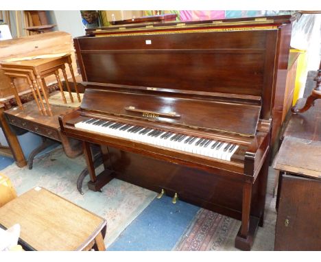 A most substantial Steinway Mahogany/Walnut cased 6 1/4 octave Upright Piano, the iron frame of the overstrung mechanism havi