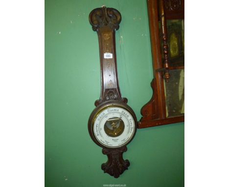 An Oak Barometer by Dolland London (a/f, thermometer missing). 33" tall.