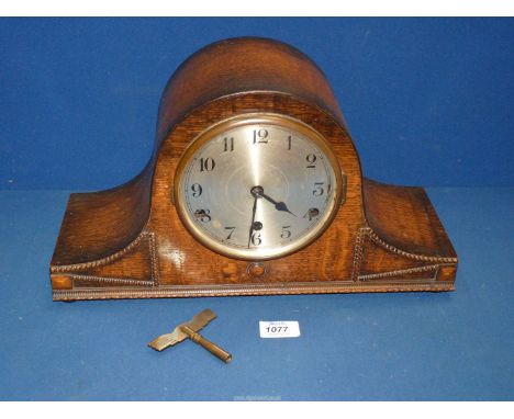 An Oak finished Napoleon's hat shaped mantle clock with Westminster chimes, with key and pendulum, 16'' wide overall x 9 1/2'