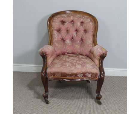 A Victorian mahogany show-frame button-back Armchair, the arched top over serpentine front seat, flanked by scroll arms and r