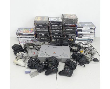 A Large selection of Sony PlayStation, including; PlayStation One, seven controllers, Falcon pistol controller, Namco pistol 