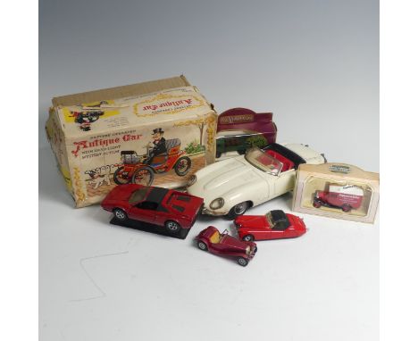 A 1960's Japanese Tomiyama tin plate model of Jaguar E type, lacking box, together with a tinplate battery operated antique c