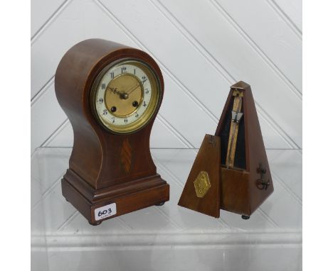 A French Metronome, brass plaque marked 1815 Maelzel Paquet 1846, and a mahogany cased mantel Clock, lacking pendulum (2)