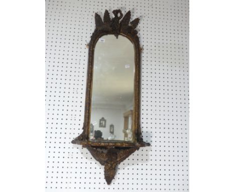 A 19th century giltwood wall Mirror, with carved giltwood leaf pediment over arched mirror plate flanked by foliate edges, ab