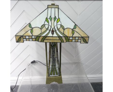 An Art Deco Tiffany &amp; Co style stained glass Lamp, the glass shade and body with stylised floral decorations, W 42 cm x H