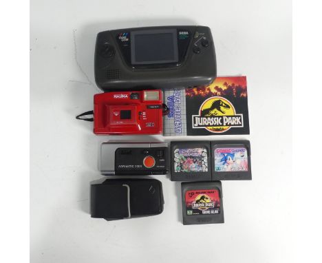 A SEGA Game Gear Portable games Console, together with three SEGA Game Gear games including; Chuck Rock, Sonic the Hedgehog, 