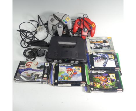 A Nintendo 64 gaming Console, together with two Nintendo 64 controllers, and five Nintendo 64 boxed games, including; Super M