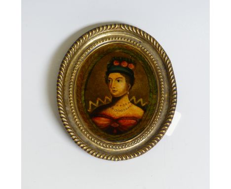 A reverse print on glass, 19th century, portrait of Queen Victoria (?), oval in embossed metal frame, 12cm x 10cm.
