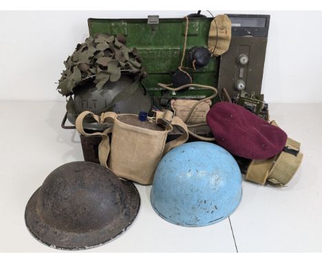 A interesting collection of WW2 and later Militaria, including; four WW2 and later Helmets, two with labels ''W.S.M. Ltd and 