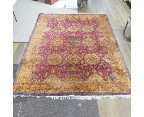A large mid 20th century Persian style red ground Carpet Square,&nbsp;machine made, worn, L ???cm x W 275cm