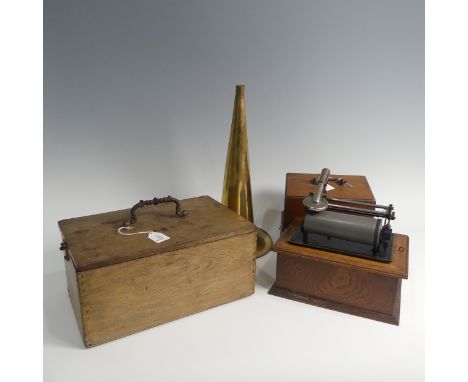 An early 20th century wax cylinder Phonograph, with reproducer and brass horn, in oak case, together with an early 20th centu