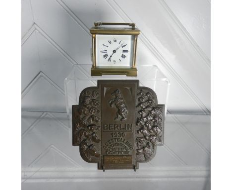 A late 19th century brass cased carriage Clock, H 9.5 cm, together with a Berlin bronze Plaque, W 17 cm(2)