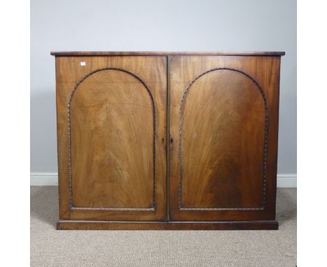 An early 19thC mahogany low Cupboard, with two arched cupboard doors, concealing shelf, raised on plinth, W 122 cm x H 96 cm 
