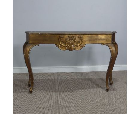 A 19th century inspired gilt painted side / console Table, the shaped top over carved foliate frieze, raised on cabriole supp