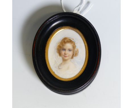 Keturah Collings (1862-1948), a portrait miniature on ivory, of a young woman in a white veil, signed K. Collings lower right