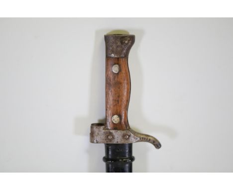 **French Berthier M1892/15 Bayonet with Scabbard**    This offering presents a French Berthier M1892/15 bayonet accompanied b