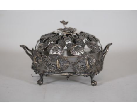 Ornate Silver Potpourri Dish with Floral Designs and Elaborate Feet  This exquisite ornate silver potpourri dish showcases in