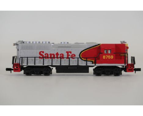 Bachmann N Scale Santa Fe Model Train Locomotive  This Bachmann N Scale model train locomotive features a striking silver and