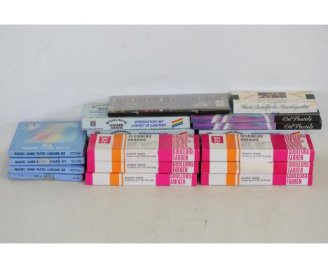 1. A collection of various art supply boxes, including:    - Several boxes of *Nupastel* colored stick pastels.    - Some box