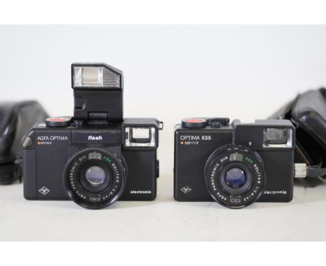 Vintage AGFA OPTIMA Sensor Cameras with Leather Cases  This vintage camera set comprises two AGFA OPTIMA models, each featuri
