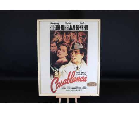 **Framed "Casablanca" Film Poster with Vintage Regal Cinema Ticket Stub**  This framed movie poster from the classic film "Ca