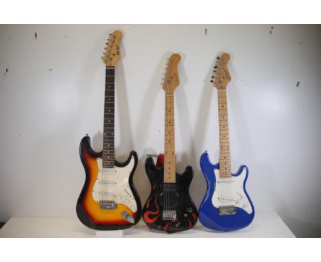 Collection of Three Electric Guitars: Sunburst, Black with Flame Design, and Blue  This unique collection features three dist
