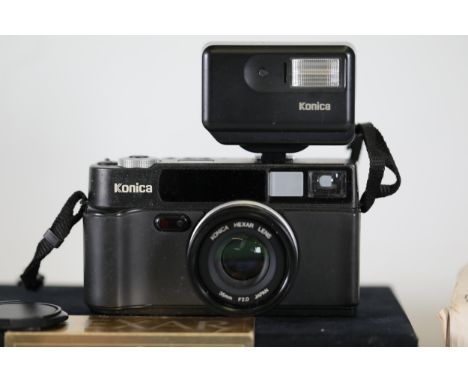 **Konica Hexar Black 35mm Rangefinder Film Camera Set with 35mm F2.0 Lens and HX-14 Auto Flash Unit**  This Konica Hexar 35mm