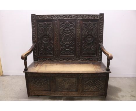 19th Century Irish Oak Monks Bench Box Settle with Mac Namara Clan Crest   This meticulously carved Irish Oak Monks Bench Box